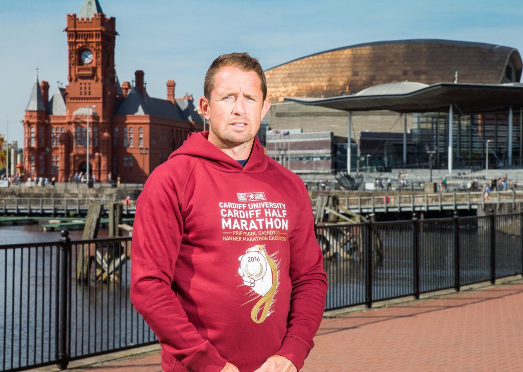 16.08.16 - Rugby legend Shane Williams with the hoodie for the 2016 Cardiff University Cardiff Half Marathon